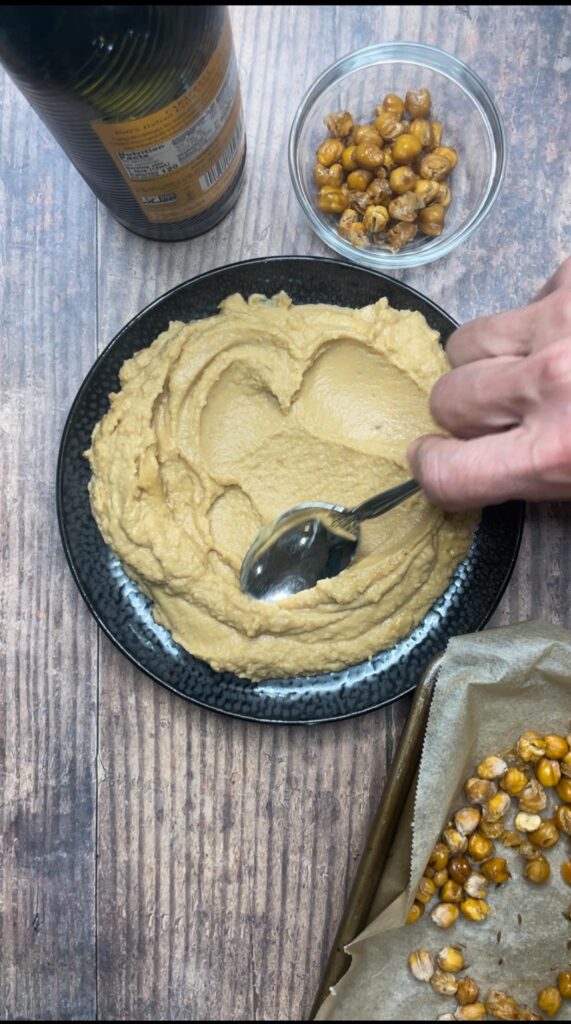 Spreading Hummus on Plate